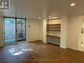 Toronto (Casa Loma) multi-family for rent - A room with a sliding glass door and a radiator on the wall.