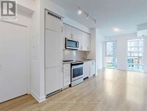 Mississauga (Creditview) condo for rent - A kitchen with white cabinets and appliances in a spacious room.