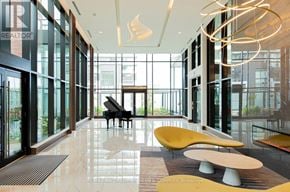 Toronto (Bayview Village) condo for rent - A piano is in the middle of a room with a lot of windows.