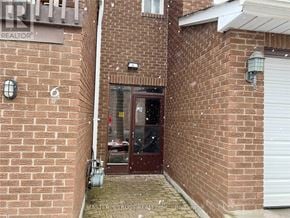Markham (Royal Orchard) townhouse for rent - A brick building with a door and a window.