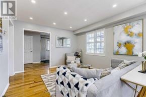 Brampton (Sandringham-Wellington) apartment for rent - A living room with a couch and a painting on the wall.