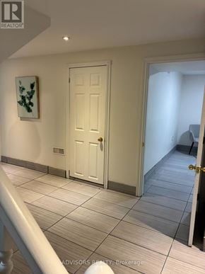 Burlington (Mountainside) apartment for rent - A white door is in a hallway with a painting on the wall.