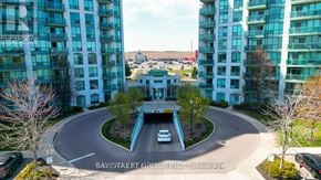 Mississauga (Central Erin Mills) condo for rent - A car is driving through a roundabout in a residential area.