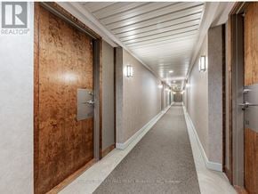 Pickering (Bay Ridges) condo for rent - A hallway with doors on both sides and a carpeted floor.