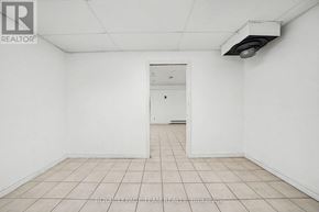 Ottawa apartment for rent - A white room with a door and a tiled floor.