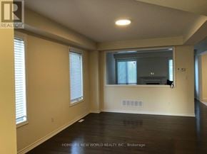 Clarington (Bowmanville) apartment for rent - A spacious room with a flat screen TV mounted on the wall.