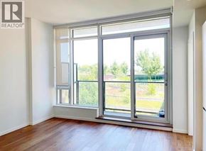 Vancouver apartment for rent - A room with a large window and wooden flooring.