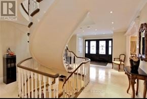 Toronto (St. Andrew-Windfields) apartment for rent - A spacious home interior with a curved staircase.