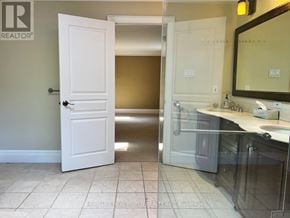 Toronto (St. Andrew-Windfields) apartment for rent - A white door is open to a bathroom.