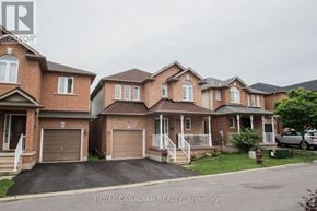 Hamilton (Stoney Creek) apartment for rent - A row of houses with the logo "Royal Canadian Realty Brokerage" in the foreground.