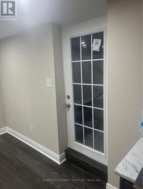 Hamilton (Lawfield) apartment for rent - A white door with a glass panel and a handle.