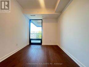 Toronto (Forest Hill South) condo for rent - A room with a wooden floor and a door leading outside.
