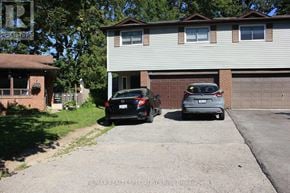 Barrie (Cundles East) apartment for rent - A red brick house with a white door and windows.