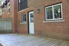Barrie (Cundles East) apartment for rent - A wooden deck with a staircase leading to a balcony.