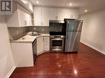 Toronto (Weston-Pellam Park) apartment for rent - A kitchen with a refrigerator, oven, and sink.