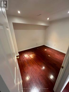 Toronto (Weston-Pellam Park) apartment for rent - A room with wooden floors and white walls.