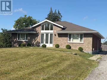 Niagara Falls (Schisler) apartment for rent - A house with a lawn in front of it.