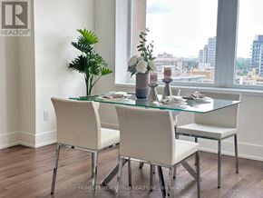Toronto (Yonge-St. Clair) condo for rent - A glass dining table with four chairs and a vase of flowers on it.