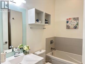 Toronto (Yonge-St. Clair) condo for rent - A bathroom with a white sink, toilet, and bathtub.