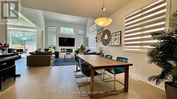 Oakville (Jm Joshua Meadows) apartment for rent - A well-lit living room with a dining table and chairs.