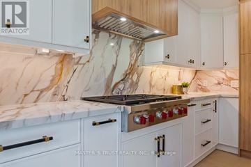 Oakville (Fd Ford) apartment for rent - A kitchen with a marble countertop and a stove top oven.