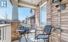 Brampton (Northwest Brampton) apartment for rent - A balcony with a table and chairs is shown.