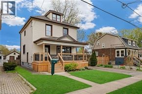 Welland apartment for rent - A house with a well-maintained lawn and a clear sky in the background.
