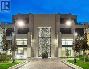 Toronto (Forest Hill South) house for rent - A modern building with a large glass door and the logo "REALTOR" on the top left corner.
