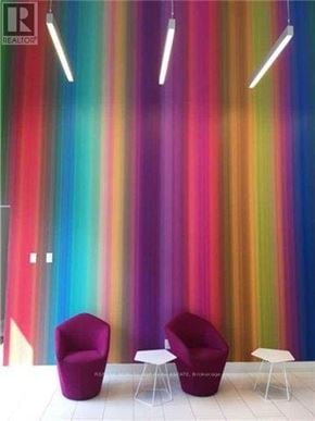 Toronto (Mount Pleasant West) condo for rent - Two purple chairs and two white tables in front of a colorful striped wall.