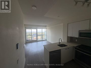 Toronto (Mount Pleasant West) condo for rent - A kitchen with a sink and a window overlooking a balcony.