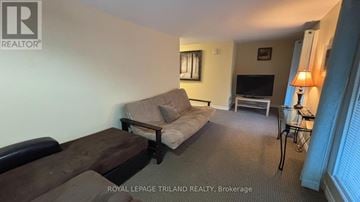 Central Elgin (Port Stanley) apartment for rent - A living room with a couch and a chair.