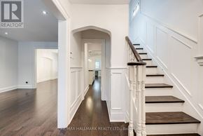 Toronto (Lawrence Park North) apartment for rent - A hallway with a staircase and a light on the wall.