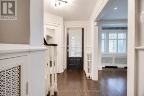 Toronto (Lawrence Park North) apartment for rent - A spacious hallway with a black door and white walls.