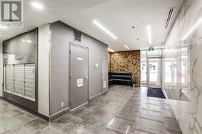 Toronto (Waterfront Communities) condo for rent - A hallway with a marble floor and a wall with a floral pattern.