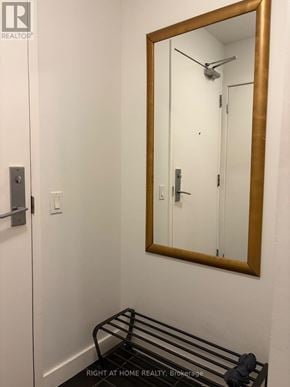 Toronto (Waterfront Communities) condo for rent - A bathroom with a mirror and a towel rack.