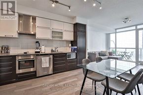 Toronto (Bay Street Corridor) condo for rent - A modern kitchen with a glass dining table and chairs.
