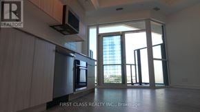 Toronto (Clairlea-Birchmount) condo for rent - A kitchen with a refrigerator, microwave, and oven.