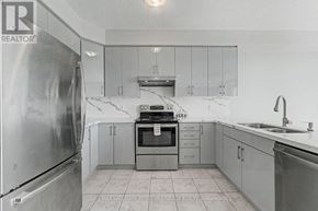 Barrie (Painswick South) apartment for rent - A kitchen with a refrigerator, oven, and sink.