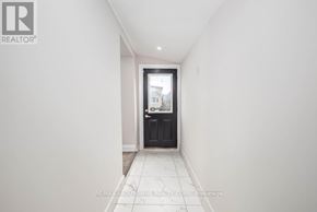 Hamilton (Landsdale) apartment for rent - A hallway with a black door and tiled floor.