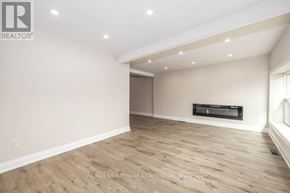 Hamilton (Landsdale) apartment for rent - A spacious room with wooden flooring and a flat screen TV mounted on the wall.