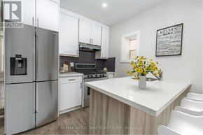 Hamilton (Landsdale) apartment for rent - A kitchen with a refrigerator, stove, and white cabinets.