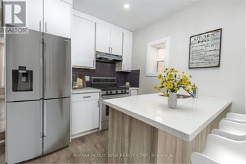 Hamilton (Landsdale) apartment for rent - A kitchen with a refrigerator, stove, and white cabinets.