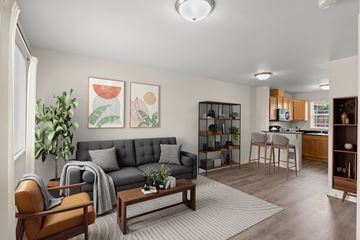 Springfield apartment for rent - A living room with a grey couch and a wooden coffee table.