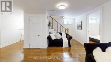 Markham (Thornhill) apartment for rent - A living room with a black couch and a white chair.
