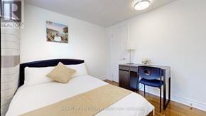 Markham (Thornhill) apartment for rent - A bedroom with a bed, desk, and chair.