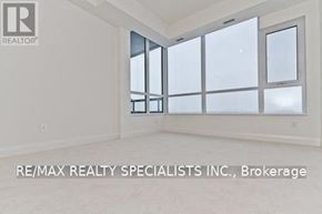 Mississauga (Port Credit) condo for rent - A room with a large window and a sign that says RE/MAX REALTY SPECIALISTS INC., Brokerage.