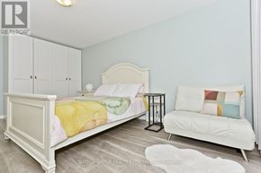 Mississauga (Applewood) apartment for rent - A dining room with a white table and blue chairs.