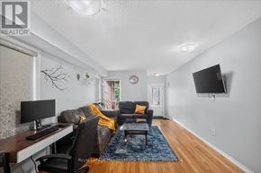 Milton (De Dempsey) apartment for rent - A living room with a couch, chair, and desk.