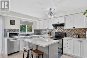 Milton (De Dempsey) apartment for rent - A kitchen with a white countertop and a tile backsplash.