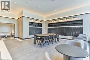 Hamilton condo for rent - A modern dining area with a long table and chairs.
